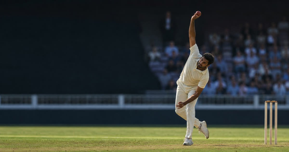 A fictional spin bowler delivering a red cricket ball on a professional ground A fictional spin bowler delivering a red cricket ball on a professional ground