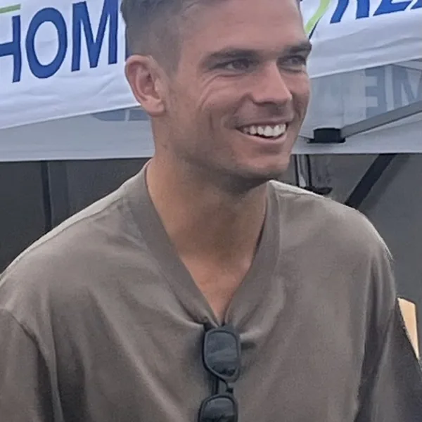 Chris Green portrait in Community event shirt