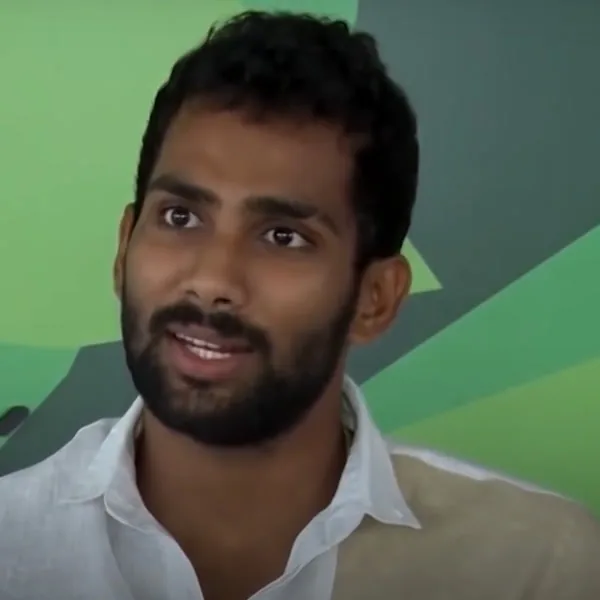 Chamika Karunaratne portrait in White collared interview shirt