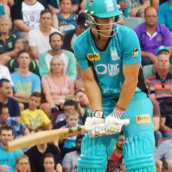 Chris Lynn portrait in Brisbane Heat BBL playing shirt and helmet