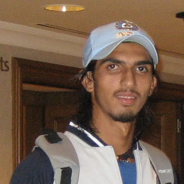 Ishant Sharma portrait in India team travel jacket and cap