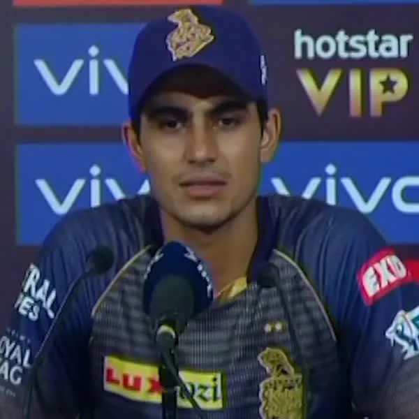 Shubman Gill portrait in Kolkata Knight Riders press-conference team shirt and cap