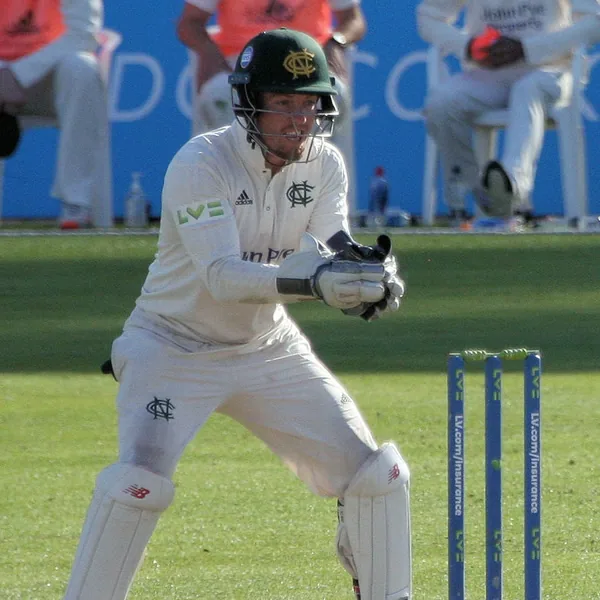 Tom Moores portrait in Nottinghamshire County Championship wicketkeeping shirt and helmet