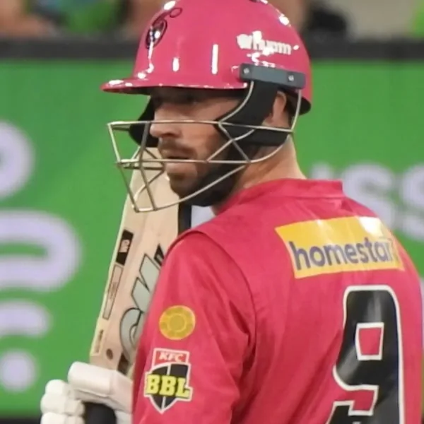 James Vince portrait in Sydney Sixers BBL playing shirt and helmet