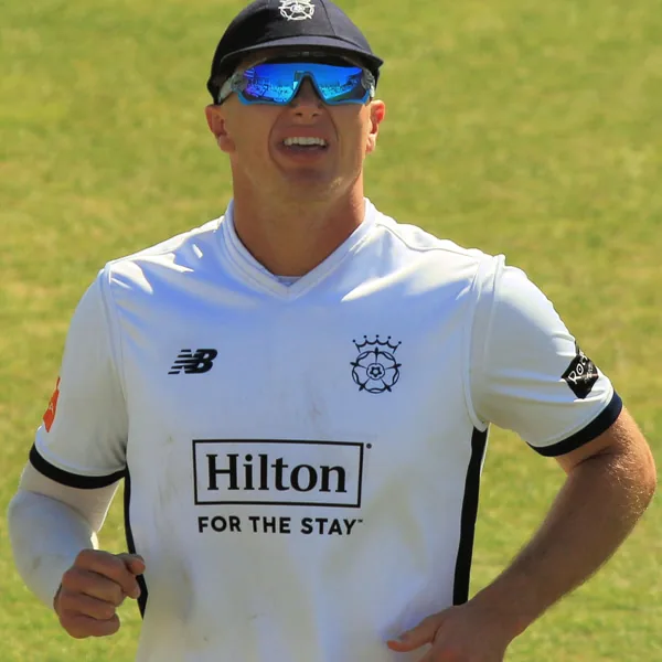 Sonny Baker portrait in Hampshire County Championship playing shirt and cap