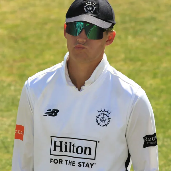 Toby Albert portrait in Hampshire County Championship playing shirt and cap