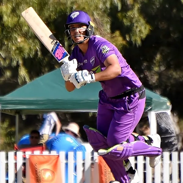 Chloe Tryon portrait in Hobart Hurricanes WBBL playing shirt and helmet