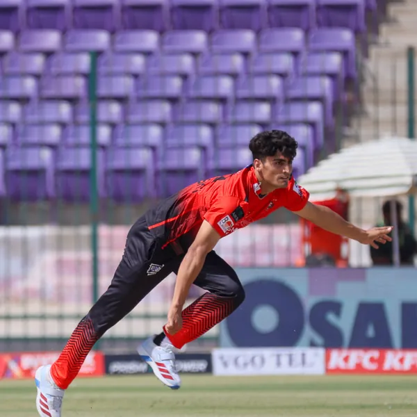 Dunith Wellalage portrait in Lahore Qalandars 2026 HBL PSL red match shirt