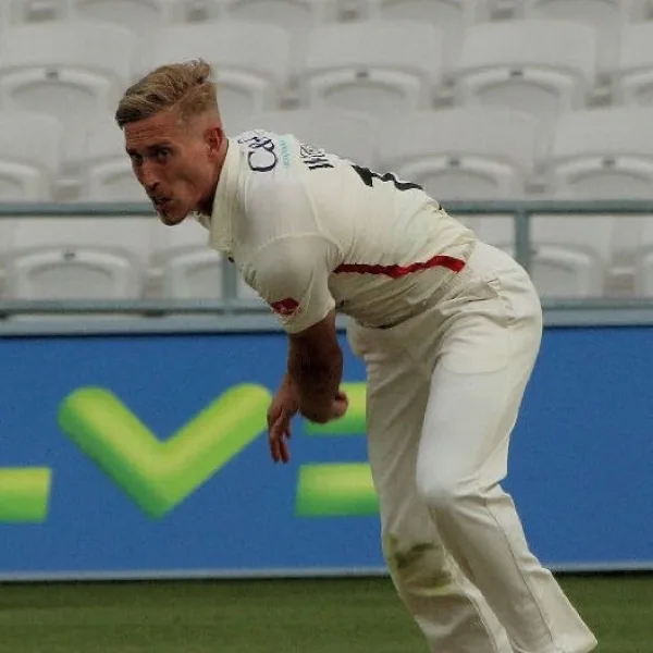 Luke Wood delivering a left-arm fast-medium ball in county cricket