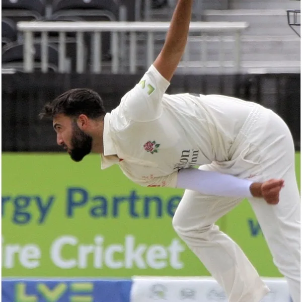 Saqib Mahmood portrait in Lancashire County Championship bowling shirt
