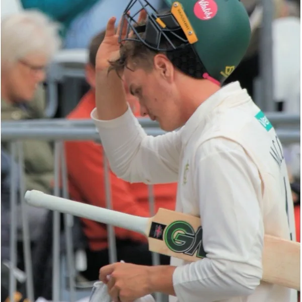 Freddie McCann portrait in Nottinghamshire County Championship batting shirt and helmet