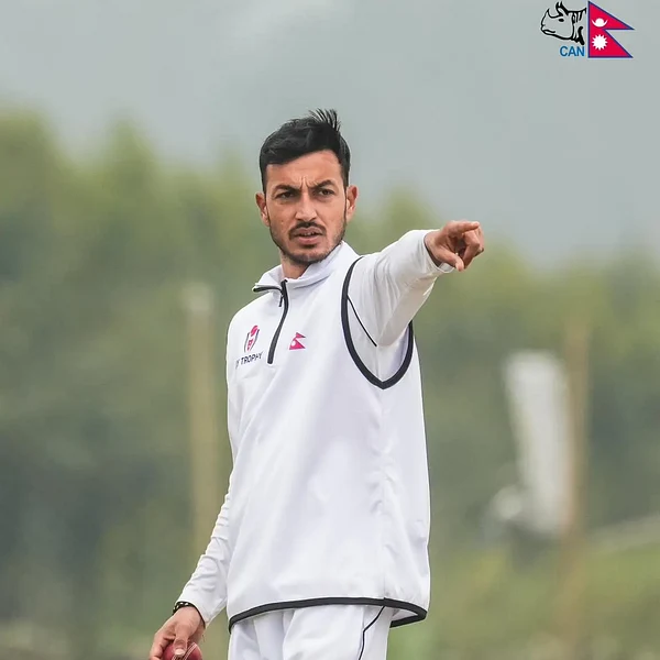 Bipin Acharya portrait in Official Cricket Association of Nepal training shirt