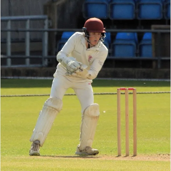 Thomas Rew portrait in Somerset age-group wicketkeeping shirt and helmet Thomas Rew portrait in Somerset age-group wicketkeeping shirt and helmet