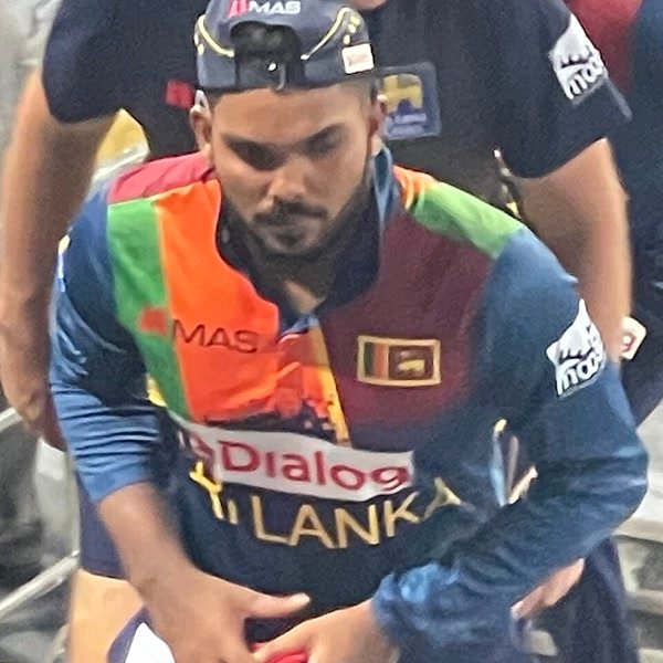 Wanindu Hasaranga portrait in Sri Lanka T20 playing shirt and cap