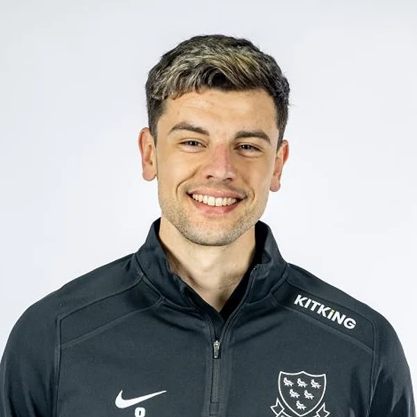 Brad Currie portrait in Official Sussex player-directory shirt or playing portrait